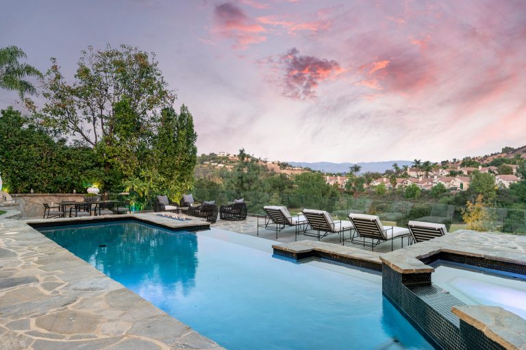 swimming pool on a patio with a stunning sky backd 2026 03 18 05 41 12 utc